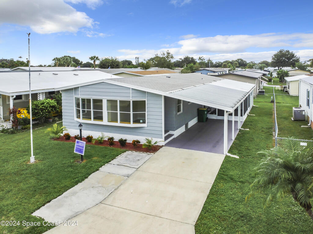 911 Hyacinth Circle, Barefoot Bay, FL 32976